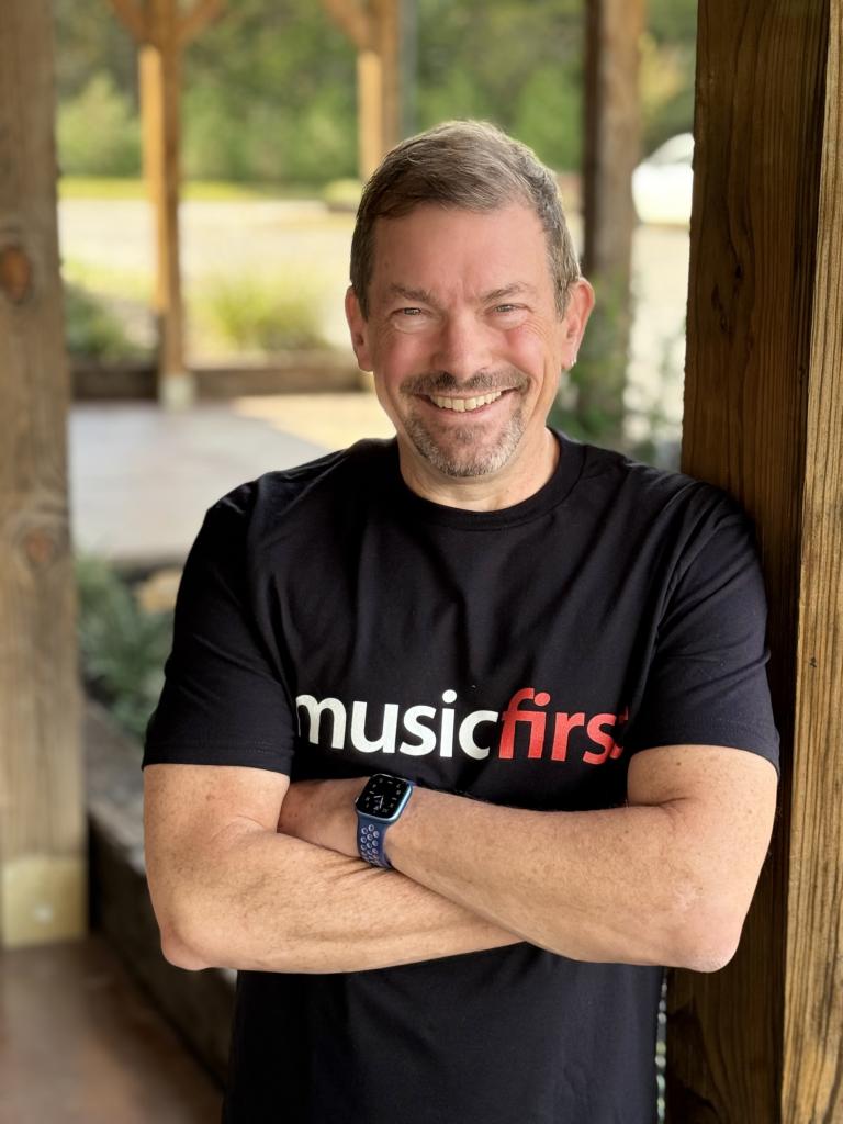 Lee Whitmore headshot, arms crossed